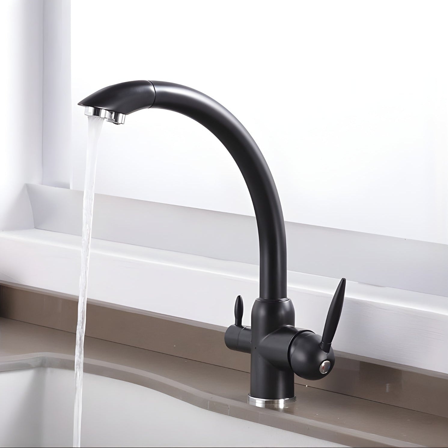 Black kitchen faucet with water flowing into a sink on a white background