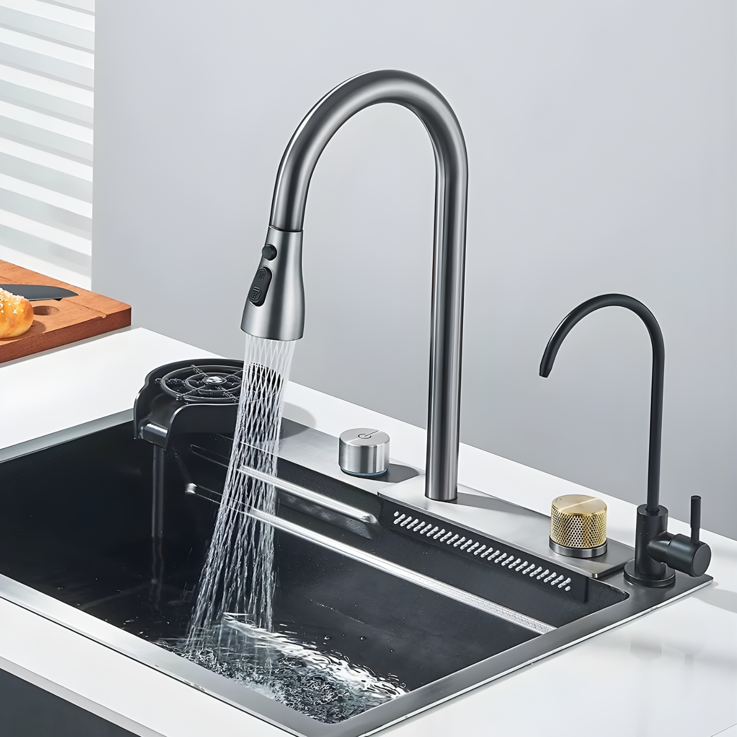 Modern kitchen sink with a silver faucet and water flowing.