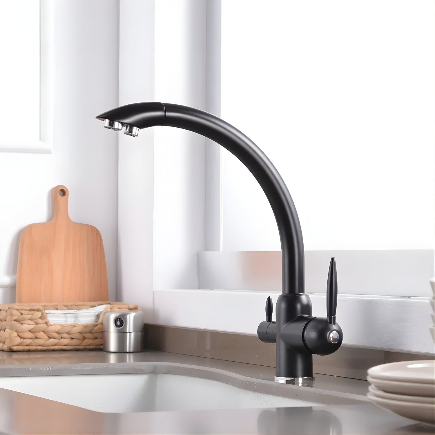 Black kitchen faucet on a kitchen counter with a cutting board and utensils in the background.