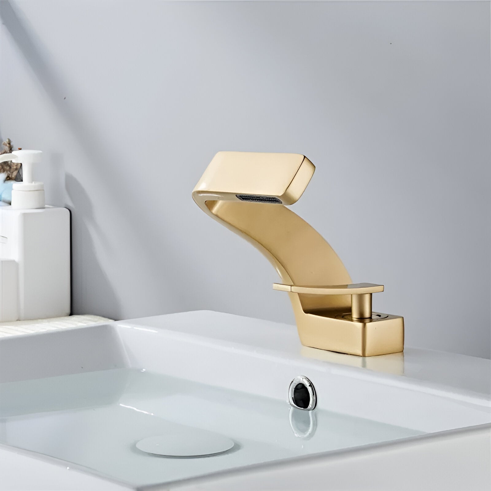 Golden modern bathroom faucet with minimalistic style