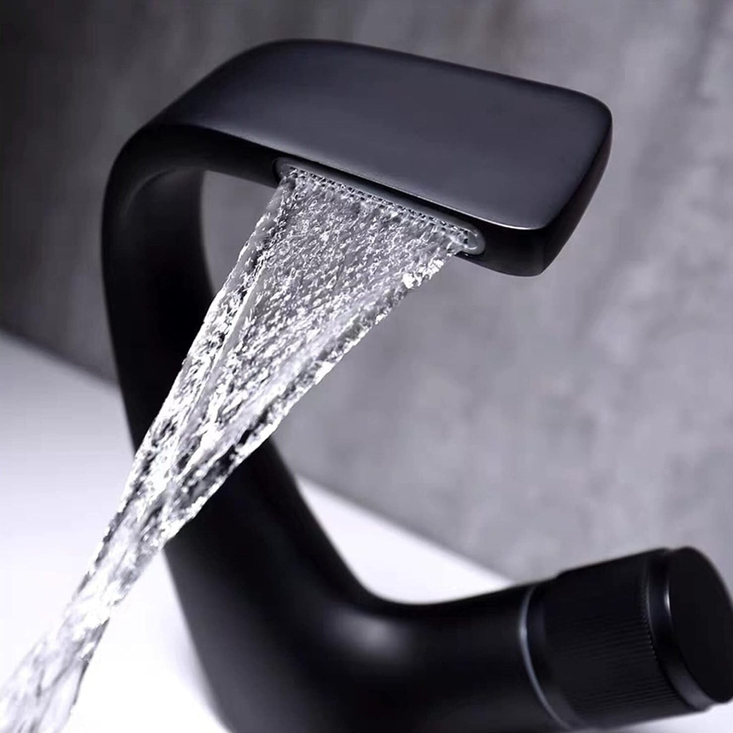 Stylish black bathroom faucet pours water