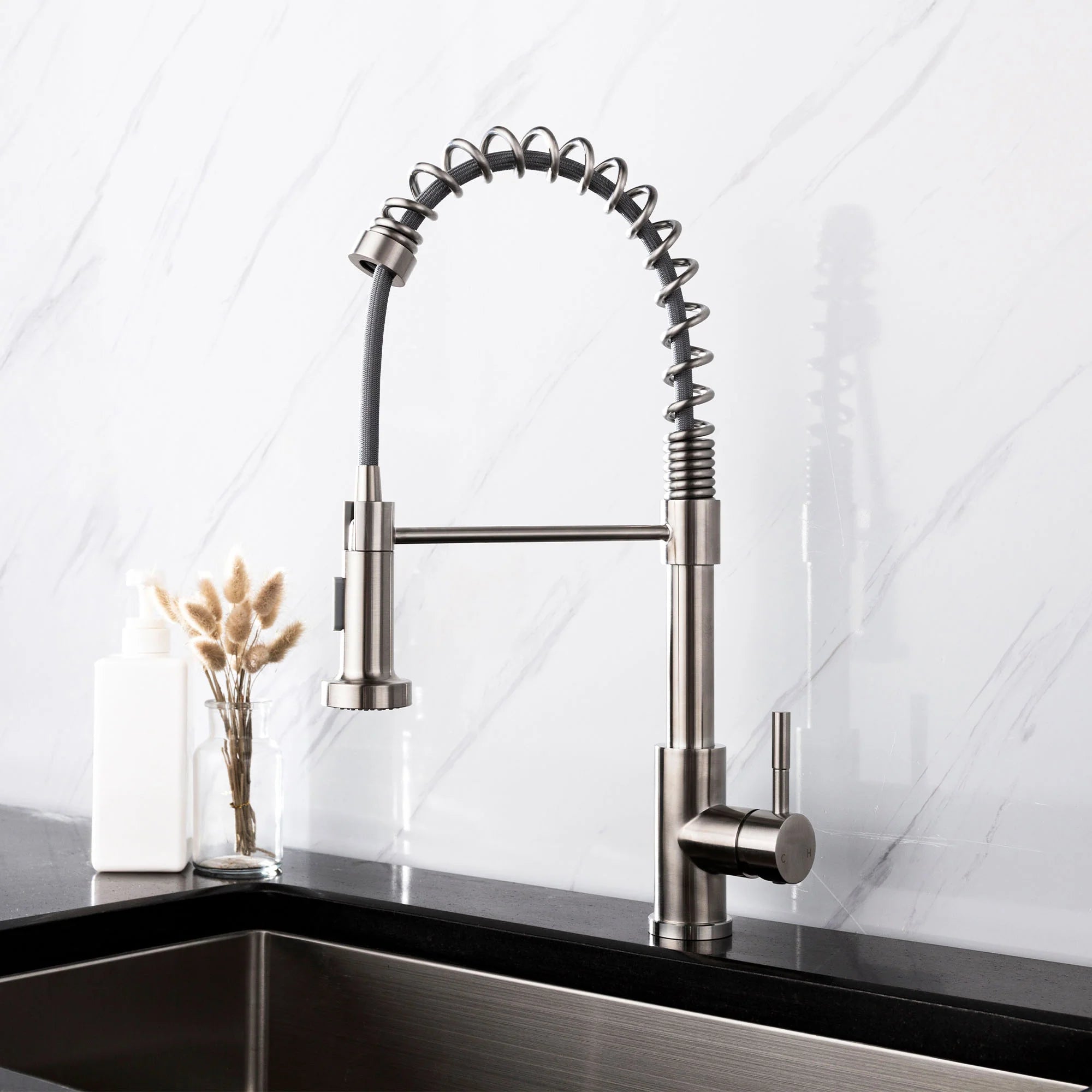 Brushed nickel professional kitchen faucet with a spring