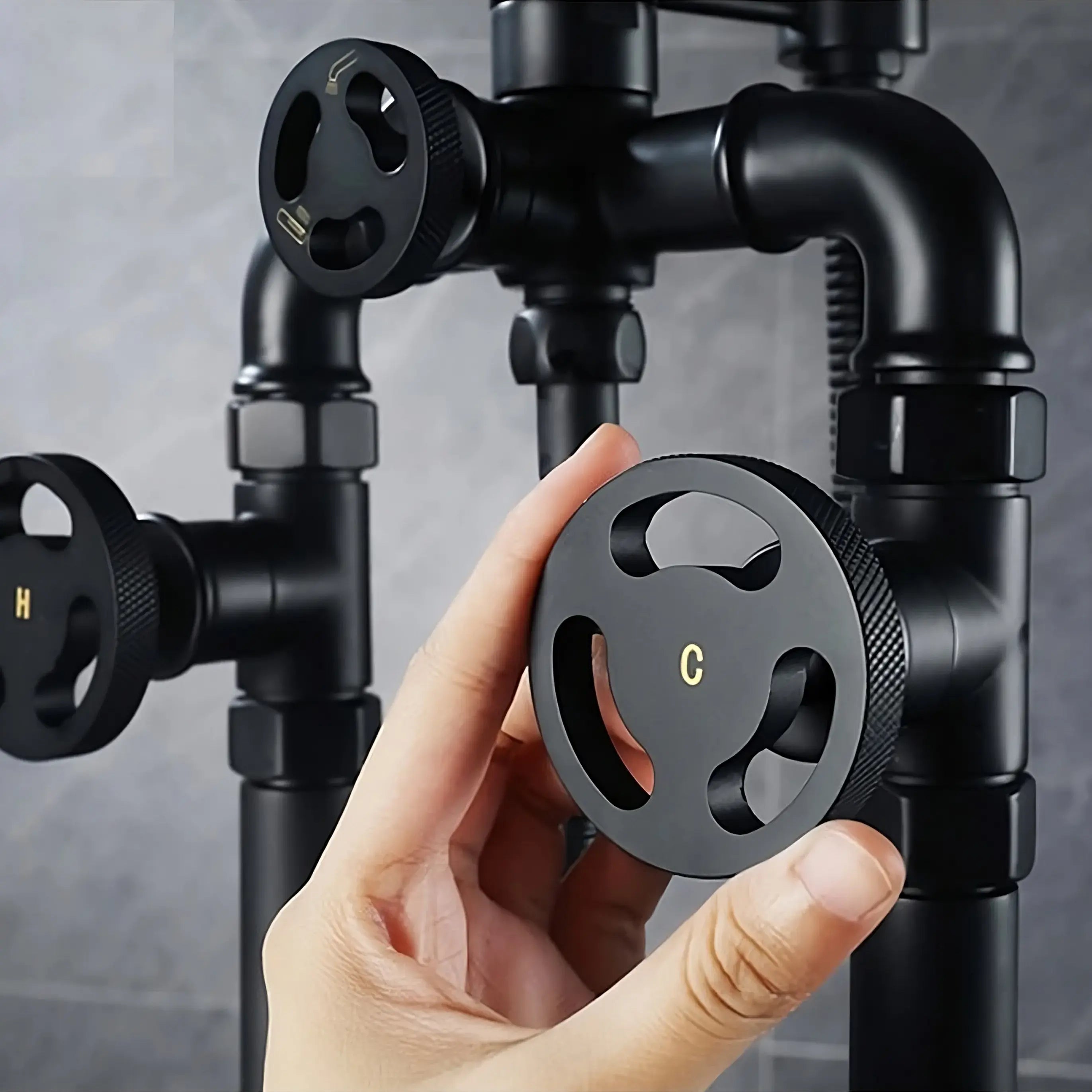 Black valve controls for a luxury bathtub filler