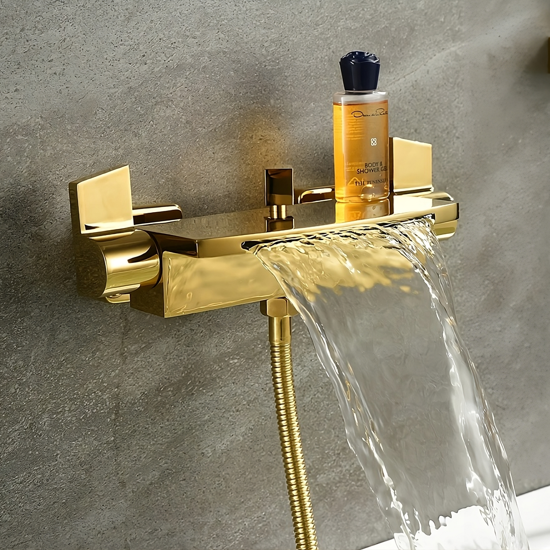 Golden color waterfall faucet in bathtub