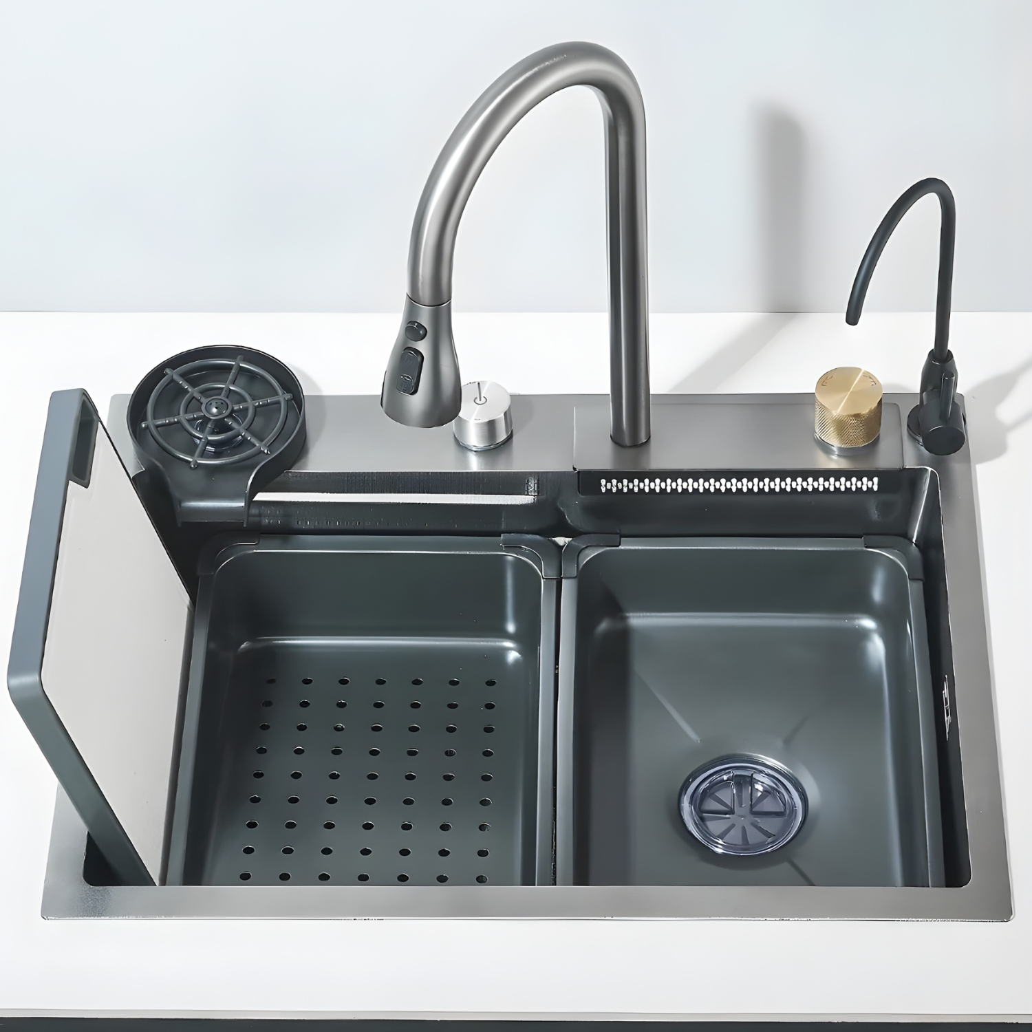 Stainless steel kitchen sink with faucet and additional features on a white background