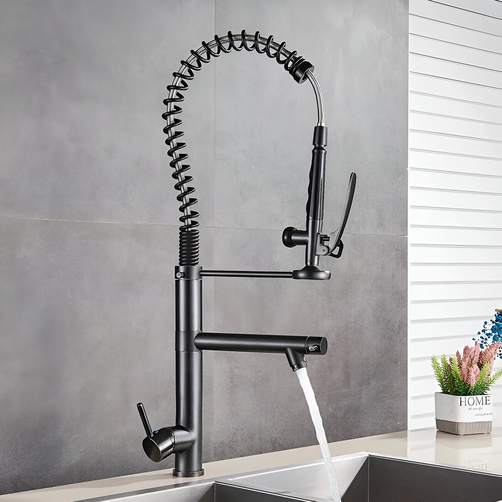 Black professional industrial kitchen faucet with a spring